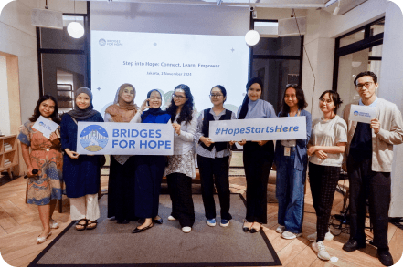 Participants holding Bridges for Hope banners